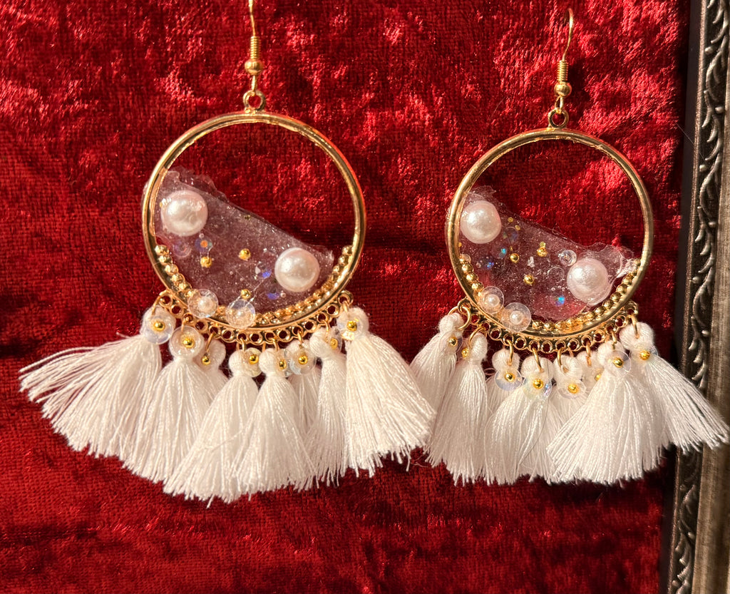 Handcrafted earrings and necklaces made with love and care.